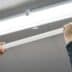 asset-12453194_Electric_hands_changing_ceiling_fluorescent_lamp._The_concept_of_repair_and_service