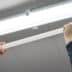 asset-12453194_application_pictures_electric_hands_changing_ceiling_fluorescent_lamp._the_concept_of_repair_and_service.